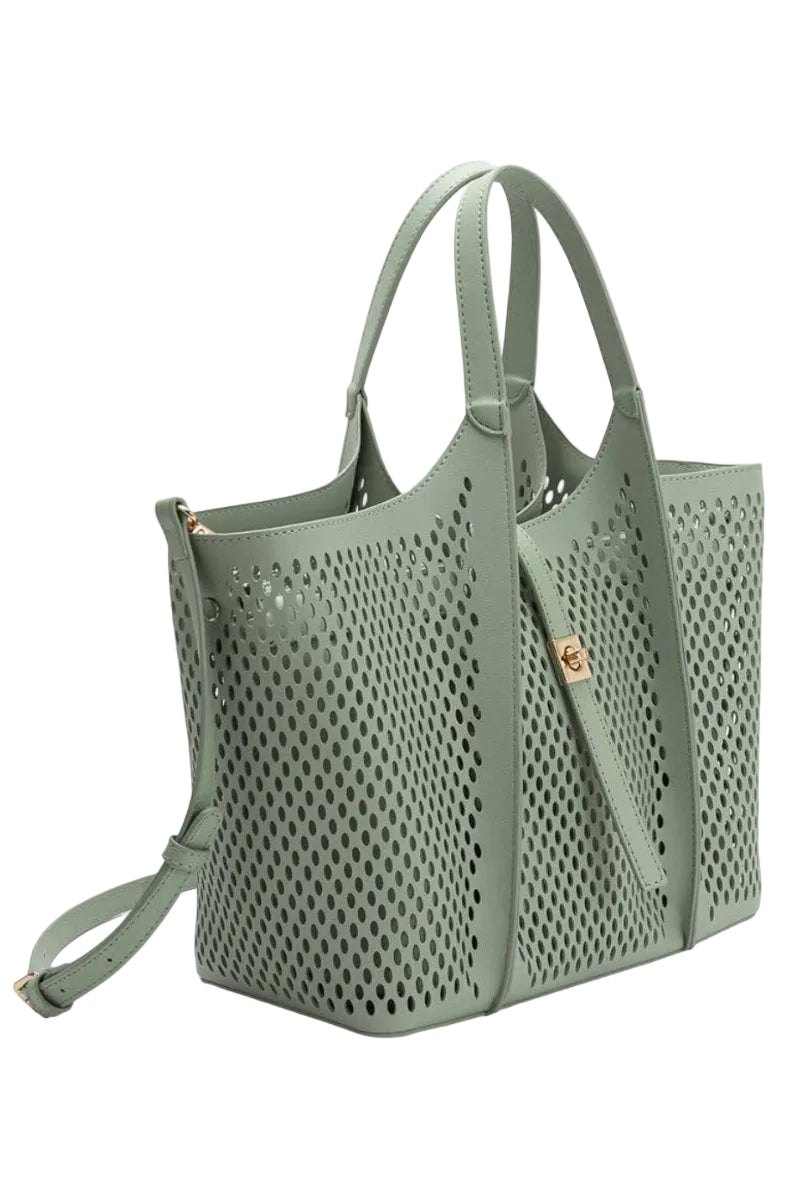 Perforated light green handbag on a white background