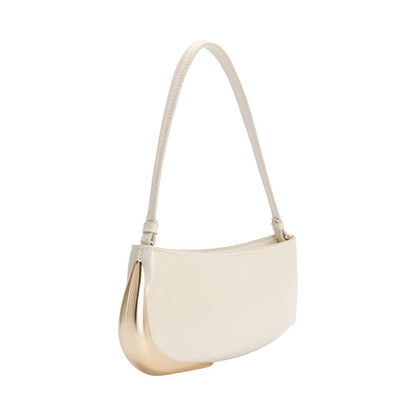 Ivory handbag with gold accents on a white background