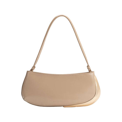 Nude handbag with a strap on a white background