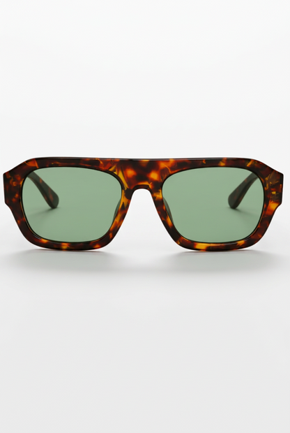 Sunglasses with tortoiseshell frame and green lenses on a white background