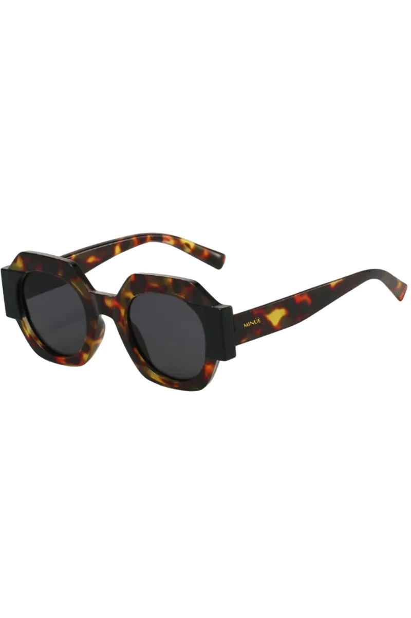Oversized square sunglasses with a bold black and tortoiseshell acetate frame and dark lenses, shown on a plain white background.