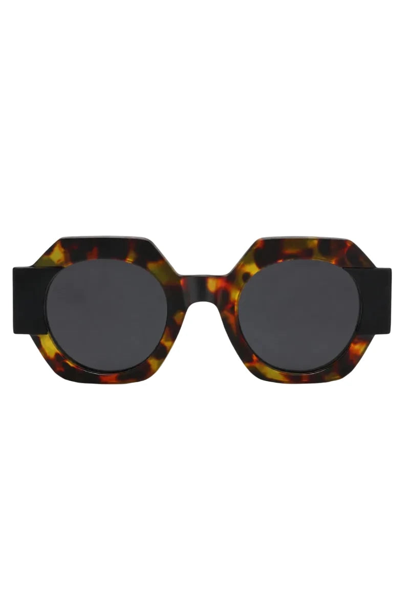 Hexagonal sunglasses with a glossy tortoiseshell acetate frame and dark gray round lenses, shown against a plain white background.