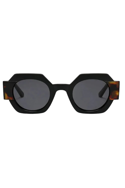 Sunglasses with a black frame and tortoiseshell accents on a white background