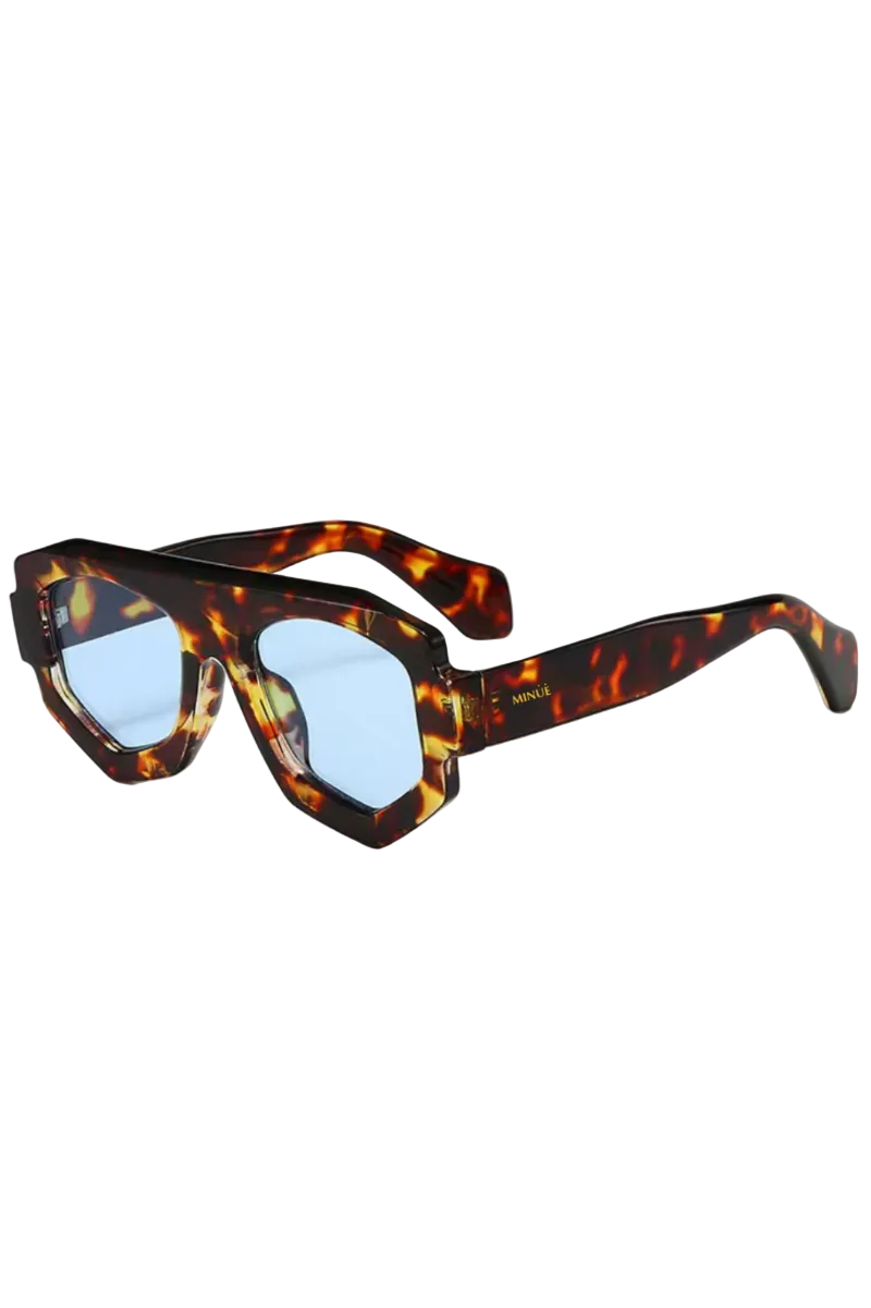 Sunglasses with tortoiseshell frame and blue lenses on a white background