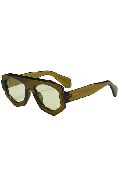 Sunglasses with a brown frame and yellow-tinted lenses on a white background