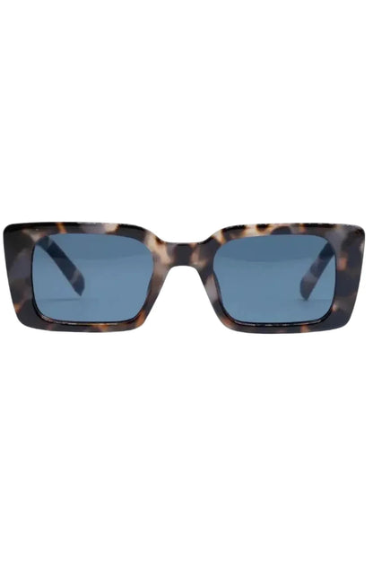 Sunglasses with tortoiseshell frame and blue lenses on a white background