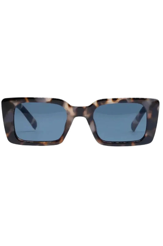 Sunglasses with tortoiseshell frame and blue lenses on a white background