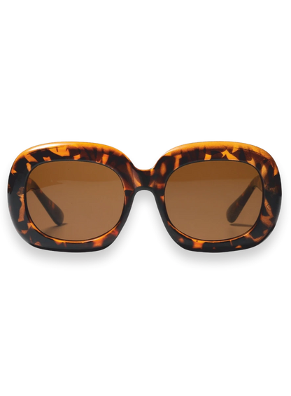 Oversized square sunglasses with a bold tortoiseshell patterned frame and warm brown lenses, shown against a plain white background.