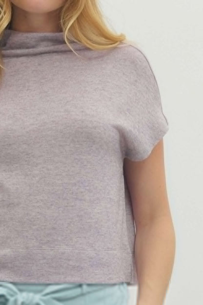 Gray t-shirt worn by a person on a light gray background