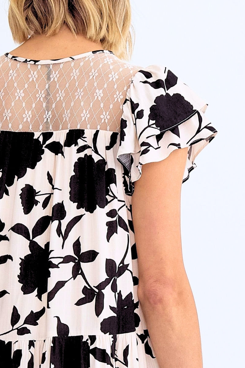 Black floral pattern on a white background