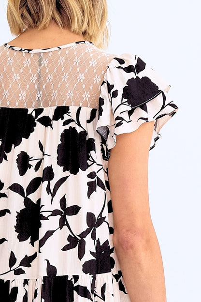 Black floral pattern on a white background