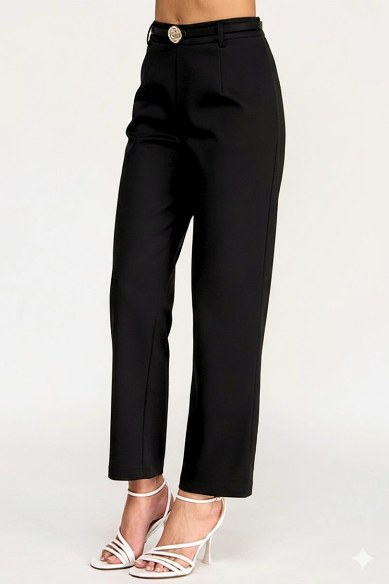 Black pants worn by a person on a white background