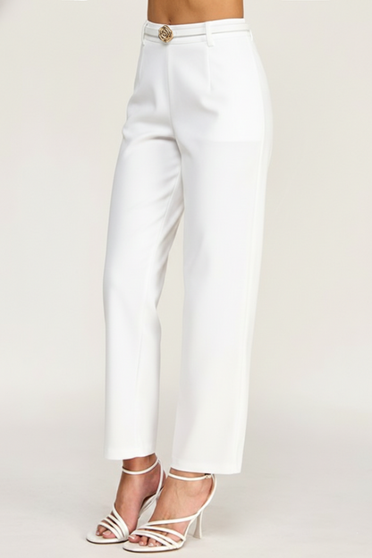 White pants worn by a person on a white background