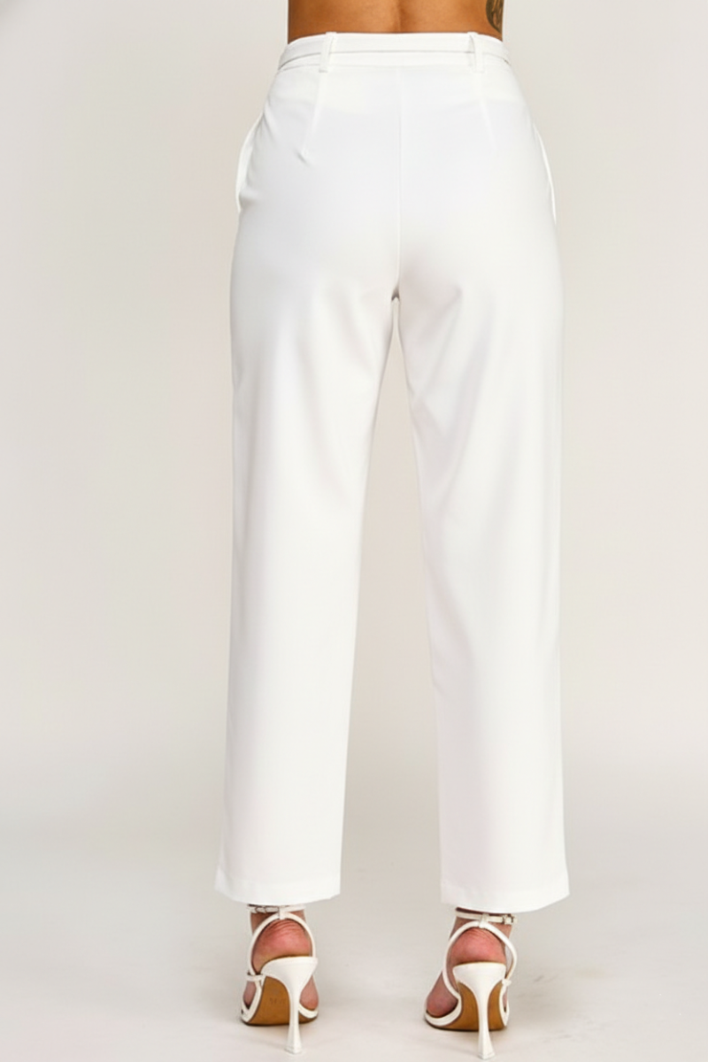 White pants worn by a person on a white background