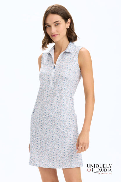 Woman wearing a sleeveless floral patterned dress on a white background