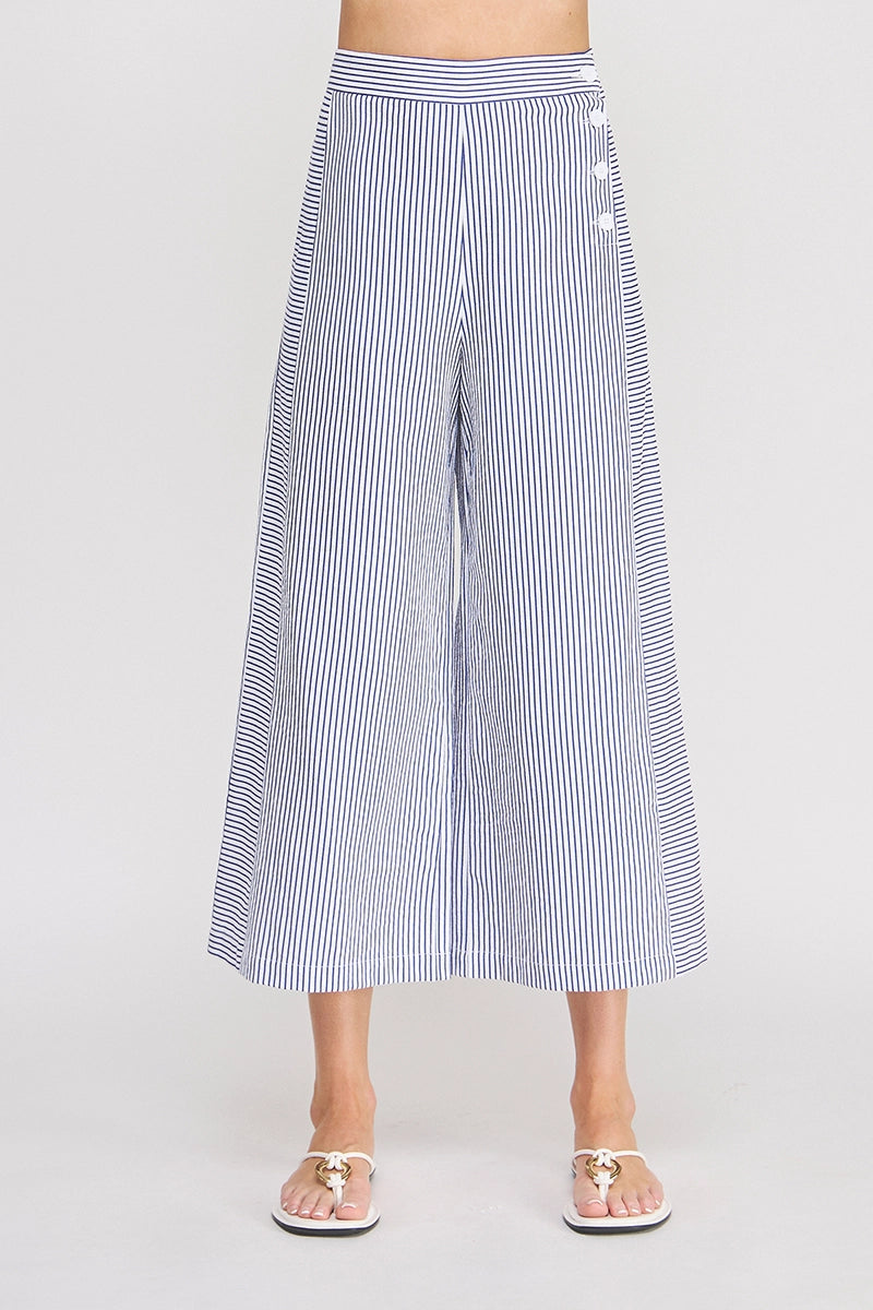 Striped wide-leg pants worn by a person on a plain background