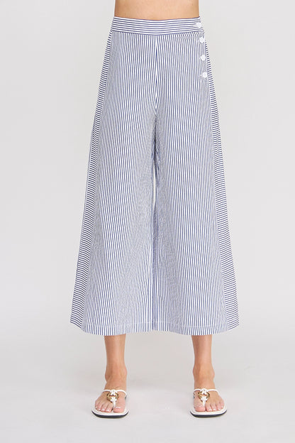 Striped wide-leg pants worn by a person on a plain background