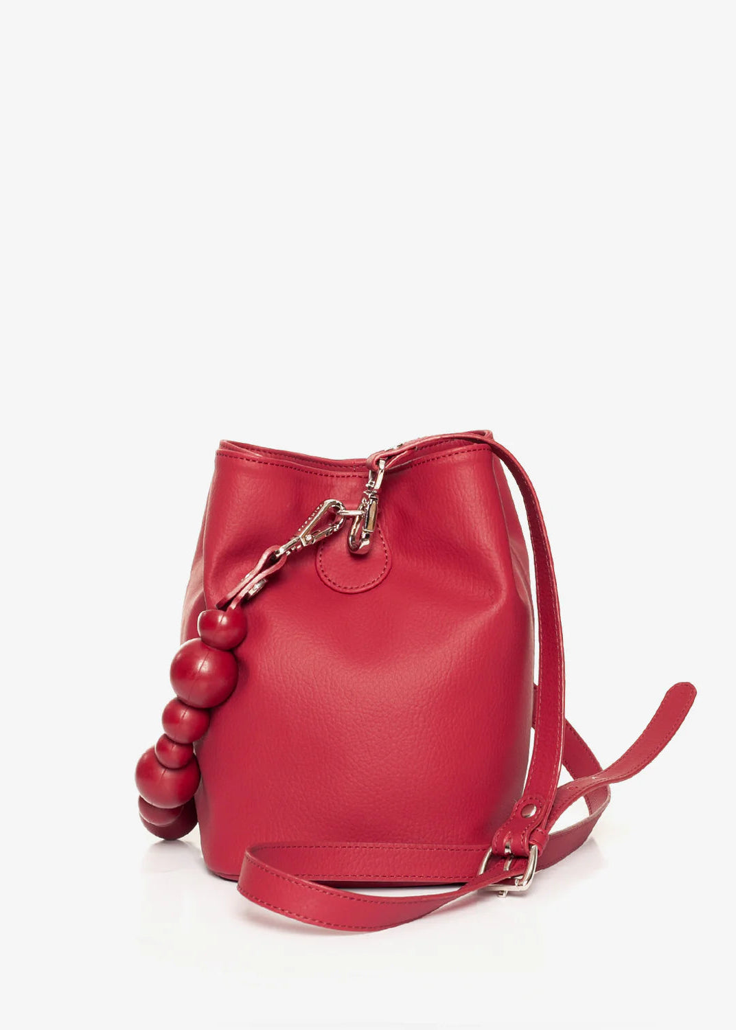 Red handbag with spherical handles on a white background