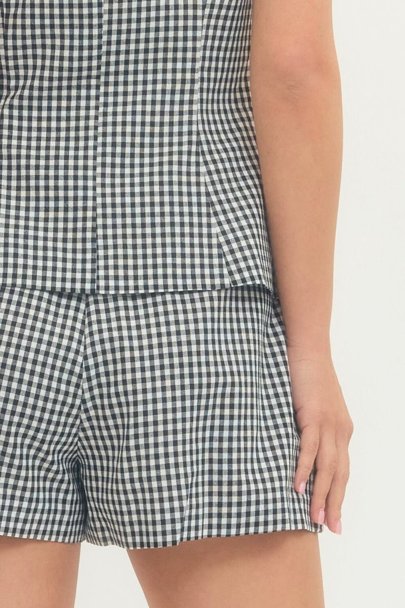 Black and white checkered shorts on a plain background