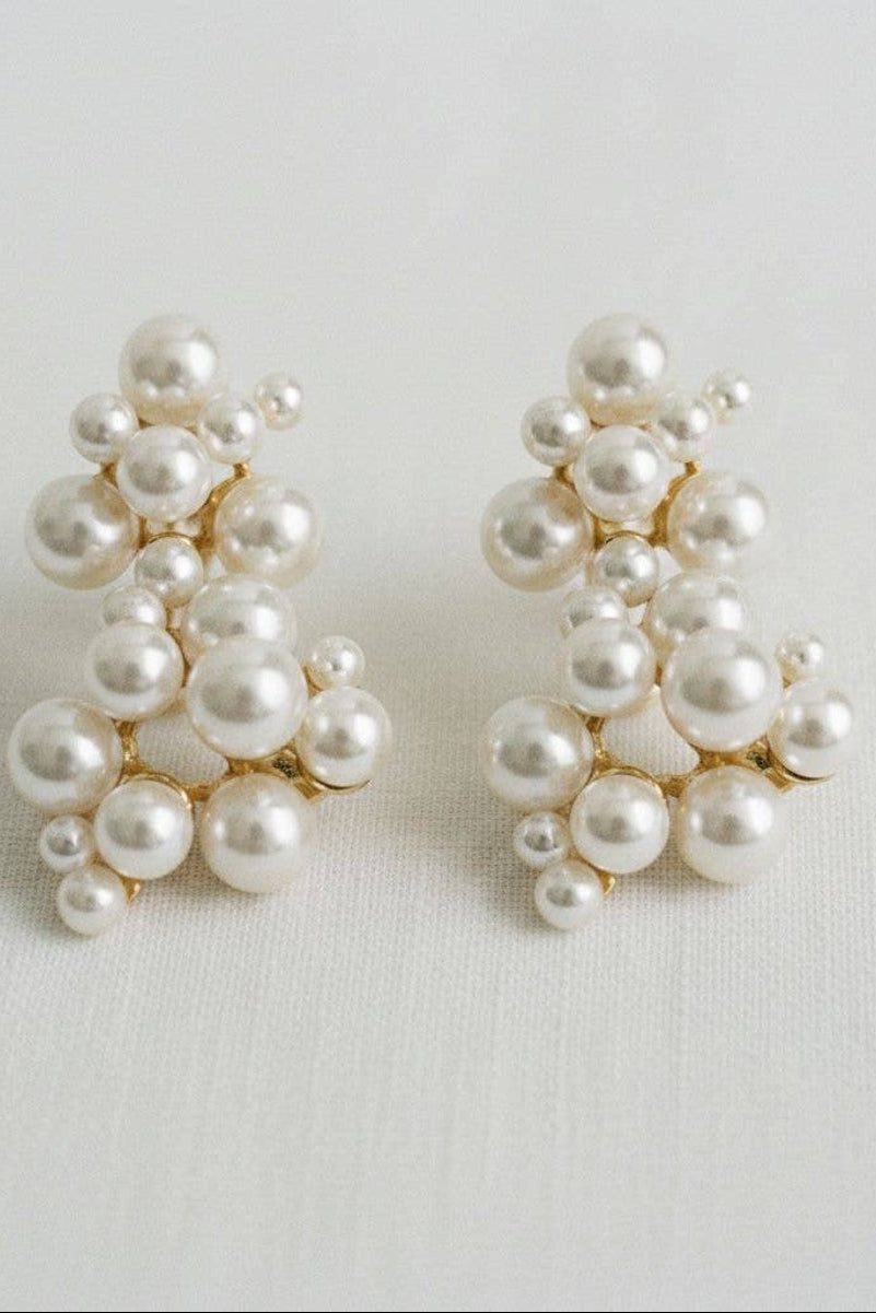 Pair of pearl earrings on a light background