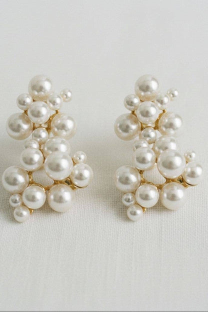 Pair of pearl earrings on a light background