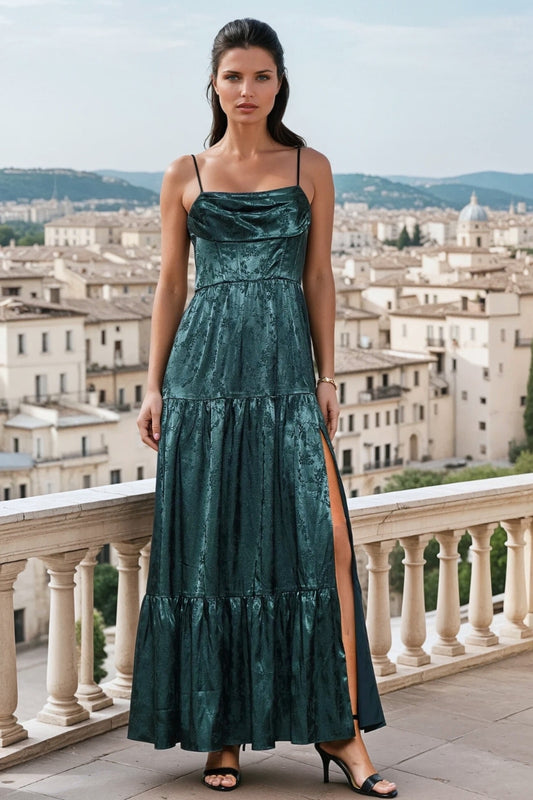 Woman in a green dress standing on a balcony with a cityscape in the background