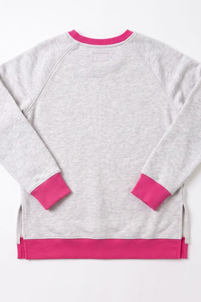 A light heather gray long-sleeve sweatshirt with vibrant pink ribbed trim on the collar, cuffs, and hem, laid flat against a white background.
