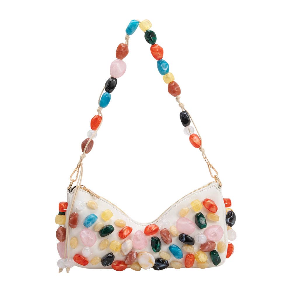 Colorful stone-themed handbag with a beaded handle on a white background