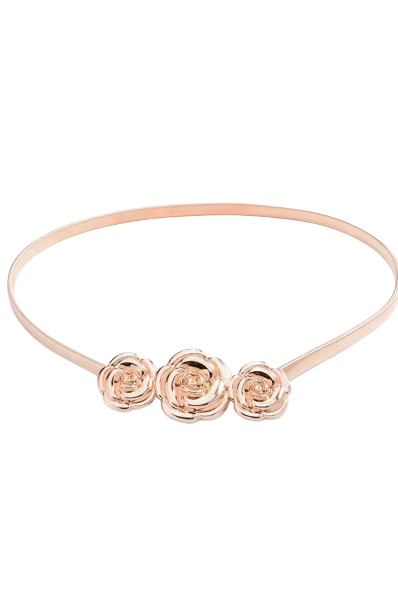 Rose gold headband with three floral designs on a white background