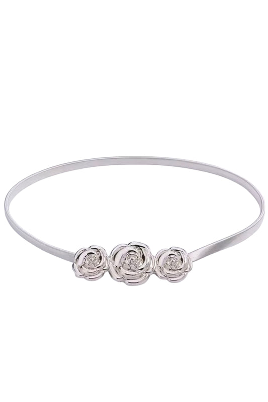 White headband with three floral designs on a white background
