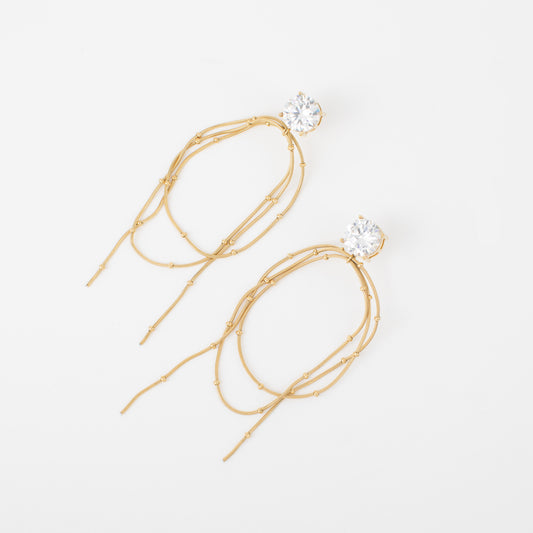 Gold hair tie with crystal ends on a white background