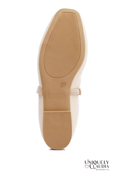 Close-up of a shoe sole with a visible brand logo on a white background