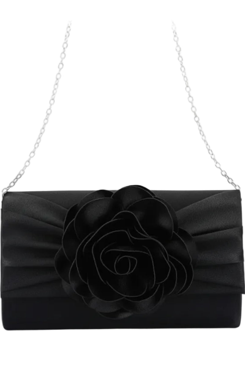 Black clutch with a large flower detail on a white background