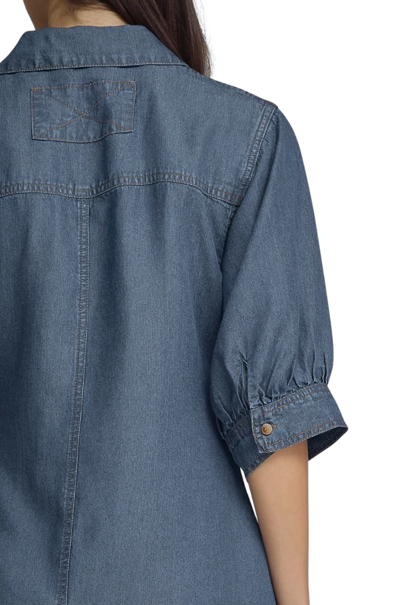 Close-up back view of a person wearing a blue denim shirt with short puff sleeves and a collar, against a plain white background.