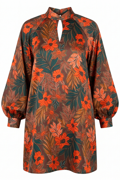 A long-sleeve dress with a high keyhole neckline, featuring a vibrant orange and brown floral print with green leafy accents on a white background.