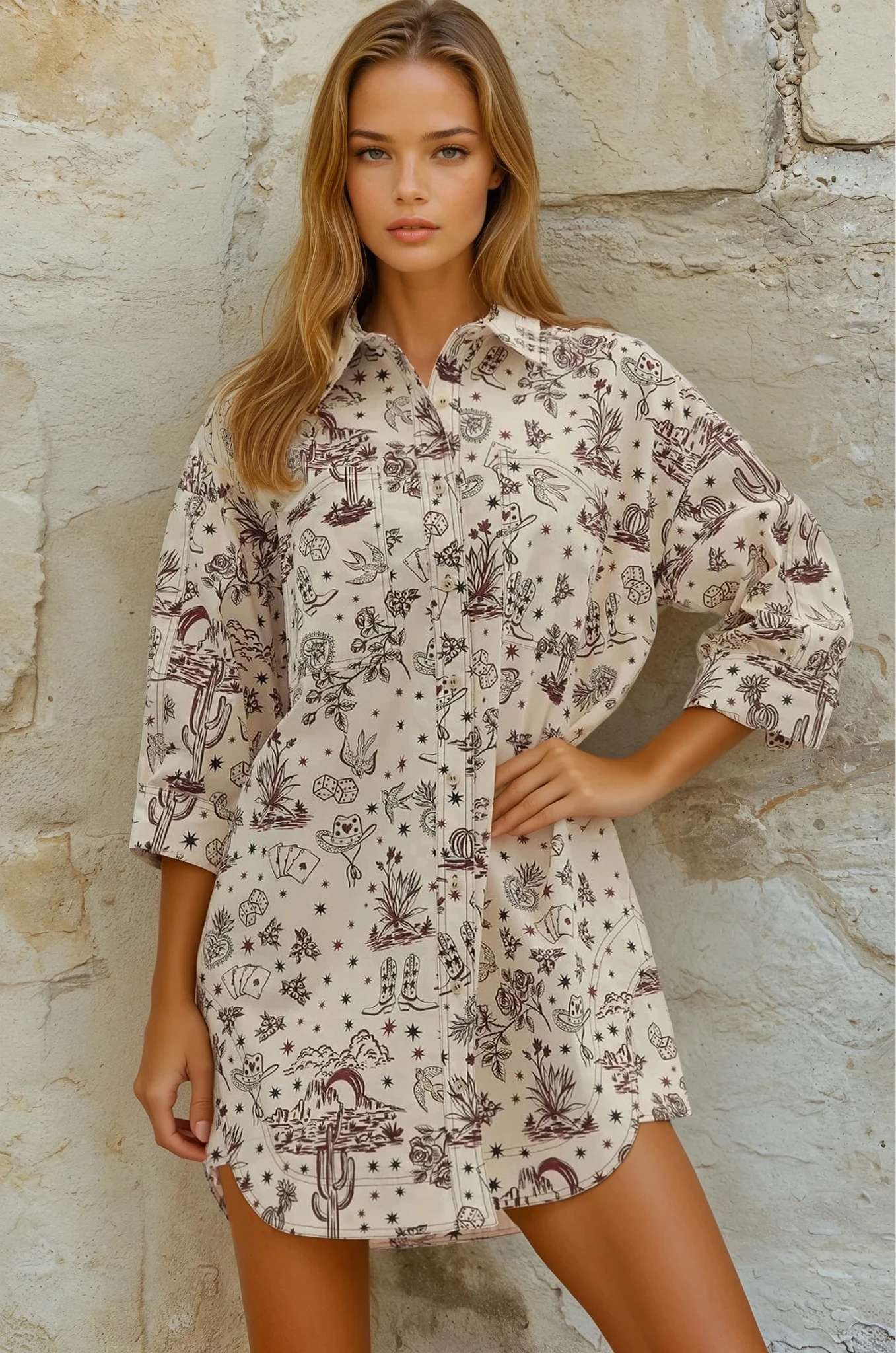 Woman wearing a patterned dress against a stone wall