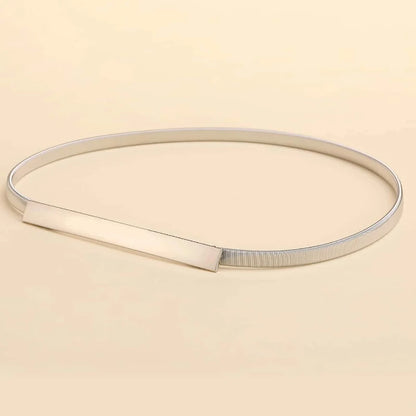 Silver belt on a beige background