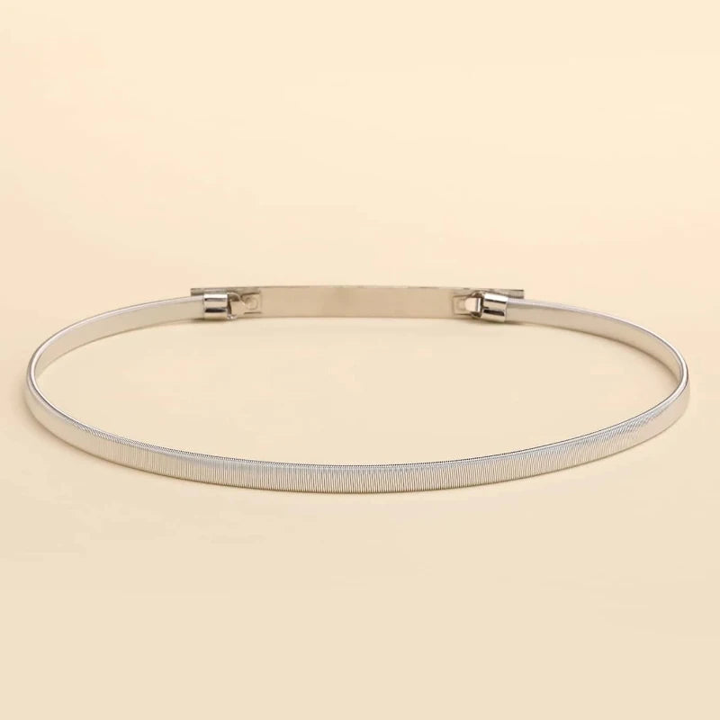 Silver bracelet on a beige background