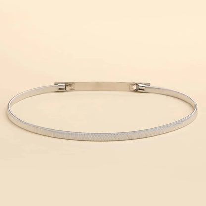 Silver bracelet on a beige background