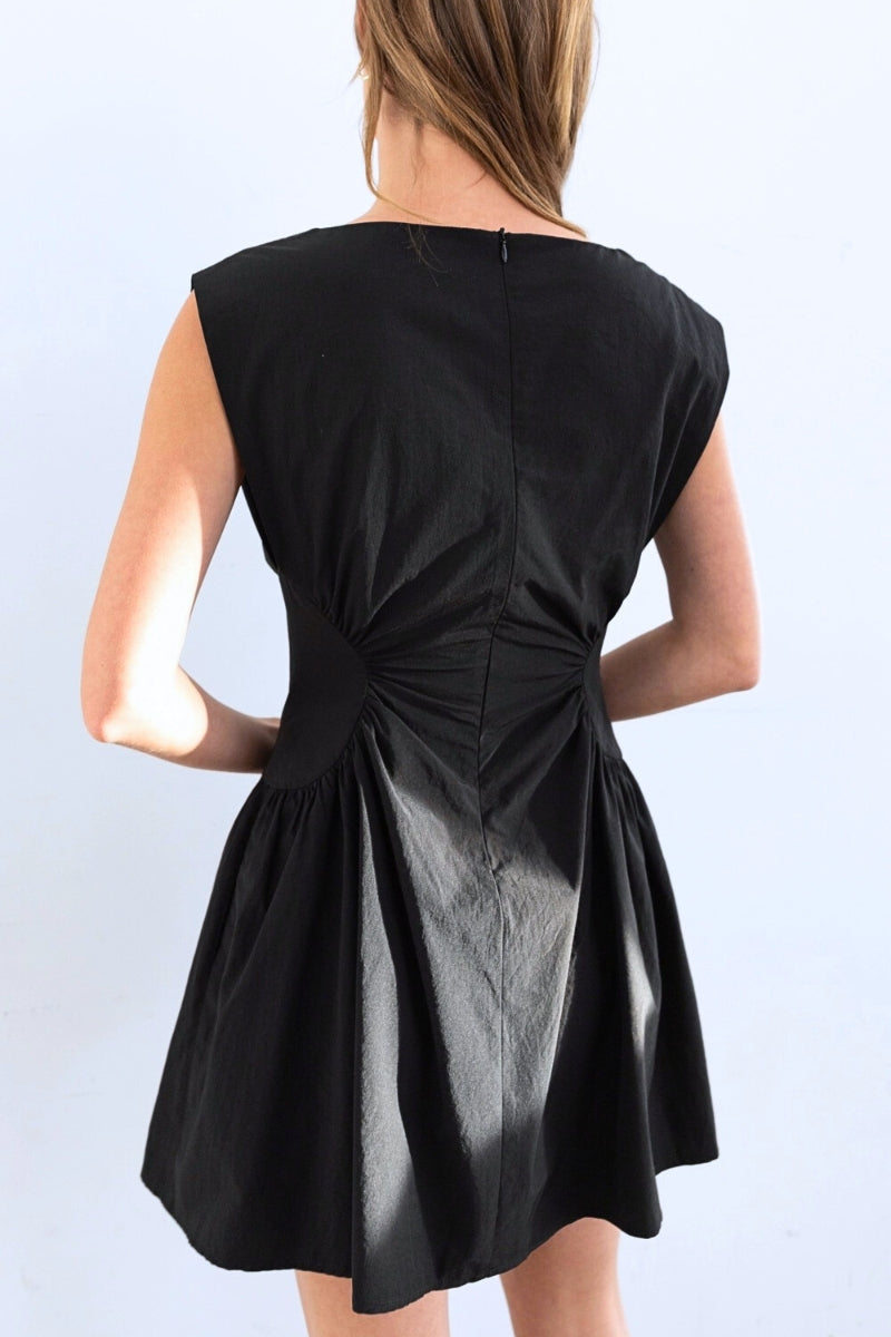 Black dress with a unique back design on a white background