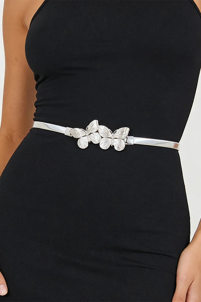 Black dress with a silver belt featuring butterfly designs on a white background