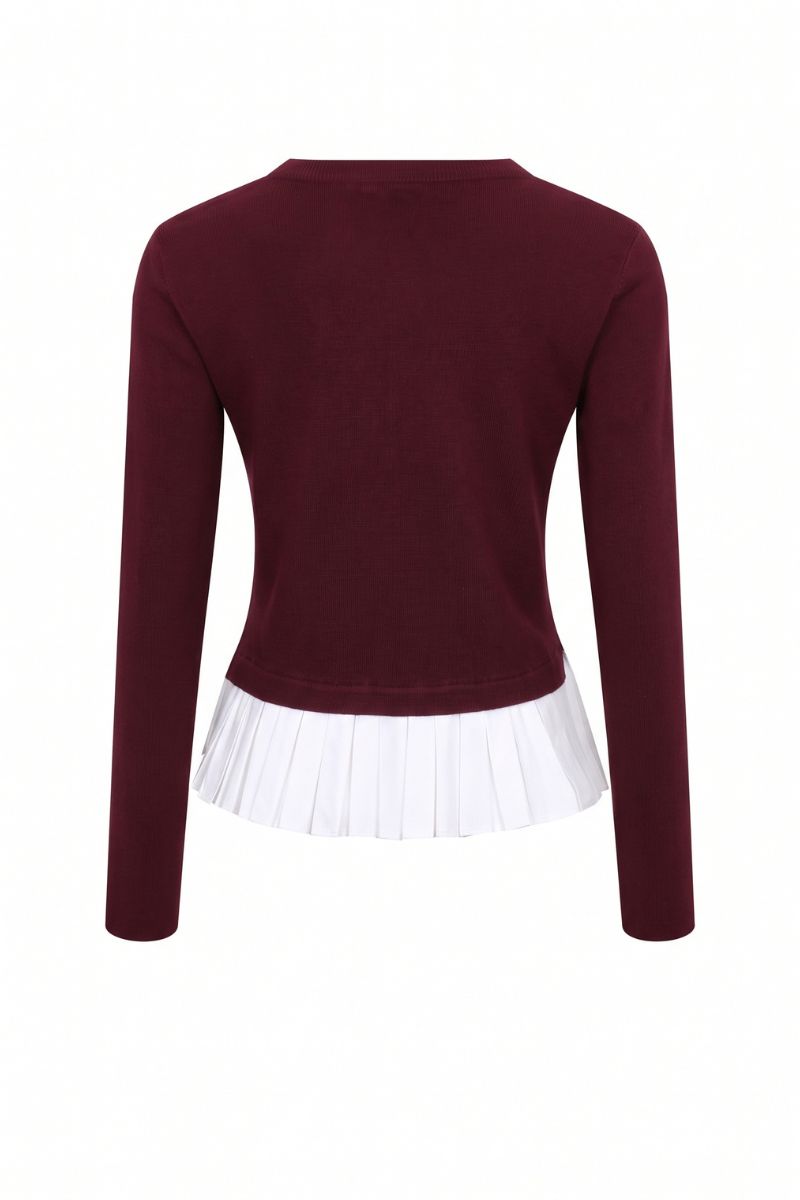 A women's long-sleeve knit top in deep burgundy, featuring a white pleated ruffle hem detail, shown from the back on a white background.