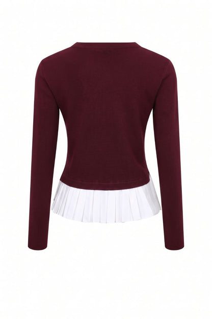 A women's long-sleeve knit top in deep burgundy, featuring a white pleated ruffle hem detail, shown from the back on a white background.