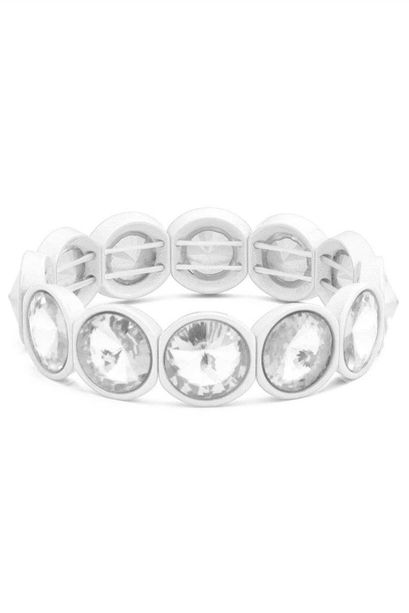 Silver bracelet with clear gemstones on a white background