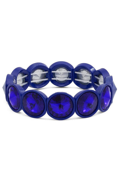 Blue bracelet with circular beads on a white background