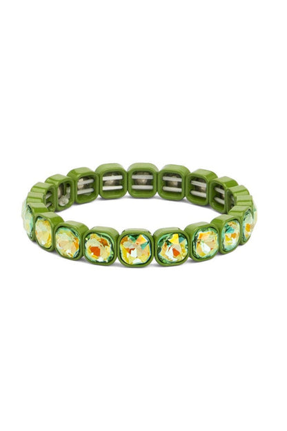 Green beaded bracelet with floral patterns on a white background