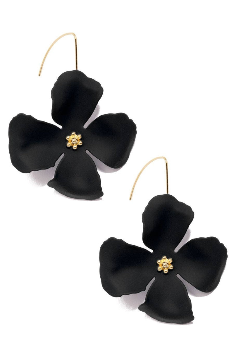 Black flower-shaped earrings with gold centers on a white background