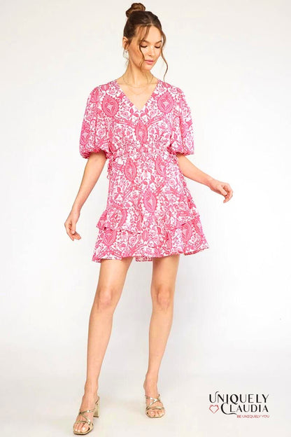 woman wearing pink puff sleeve dress