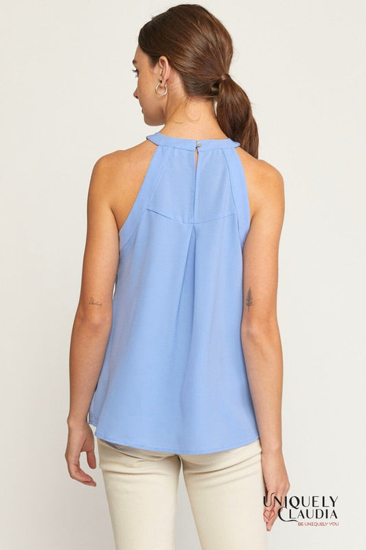 Woman wearing periwinkle halter top